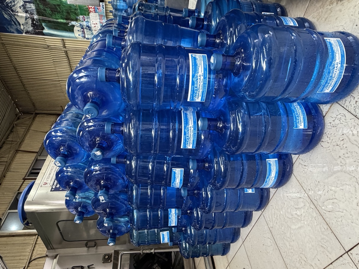 Filled twenty-litre jars stacked at the Aqua Himshikhar plant in Kageshwori